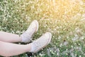 Close-up shoes hipster young girl relaxed time and enjoying nature around in the forest.