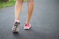 Close up shoes, legs. sport runner woman back view running, girl walking in park. Sport exercise benefit. Royalty Free Stock Photo