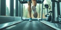 Close up shoes man& x27;s muscular legs feet during running on treadmill workout Royalty Free Stock Photo