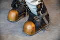 Close-up shoes of an old vintage three-bolt deep-sea diving suit. Suit for deep sea diving of the last century. The Royalty Free Stock Photo