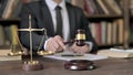 Close up Shoot of Judge Hand Banging the Gavel in Court Room Royalty Free Stock Photo