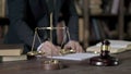 Close up Shoot of Judge Hand Reading Paper in Court Room Table Royalty Free Stock Photo