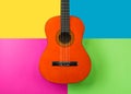 Close-up shot of acoustic guitar against colorful background Royalty Free Stock Photo