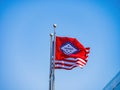 Close up shot of American and Arkansas state flag swinging