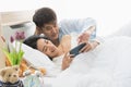 Woman uses smart phone, boyfriend  watches her Royalty Free Stock Photo