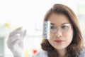 Scientist holding test tube tray in her hand Royalty Free Stock Photo