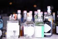 A close-up shot of assorted alcohol bottles lining the shelves, perfect for nightlife