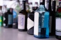 A close-up shot of assorted alcohol bottles lining the shelves, perfect for nightlife