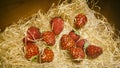 Assortment Of Artificial Strawberries On Straw
