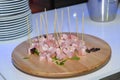 Close-up shot of an assortment of bite-sized pieces of meat with toothpicks