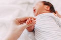 newborn baby holding mother& x27;s finger Royalty Free Stock Photo