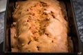 A close up shot of a baked cake or pie, cracked in the middle, i