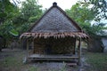 Close up shot of a bamboo bungalow hostel with a thatch roof made of palm tree leaves, a wooden foundation, patterns on the walls Royalty Free Stock Photo