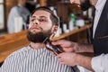 close-up shot of barber shaving man Royalty Free Stock Photo
