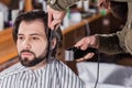 close-up shot of barber shaving man Royalty Free Stock Photo