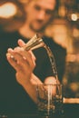 Bartender pouring whisky in a glass Royalty Free Stock Photo