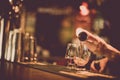 Bartender pouring whisky in a glass Royalty Free Stock Photo