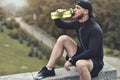 Close-up Shot Bearded Sportive Man take a rest and drink a water After Workout Session.