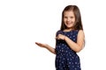 Close-up studio shot of beautiful brunette little girl posing isolated on white studio background.