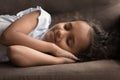 Beautiful Indian girl sleeping on sofa at home, closeup shot