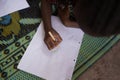 Close up Shot of Black African Woman working on her homework and education Royalty Free Stock Photo