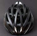 Close-up shot of a Black cycling helmet on dark background