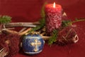 close-up shot, blue Christmas tree ball decoration, with golden cross and a red candle in front of r Royalty Free Stock Photo