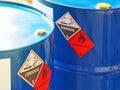 The Close-up Shot Of Blue Color Hazardous Dangerous Chemical Barrels ,have Warning Labels Of Corrosive & Flammable Liquid
