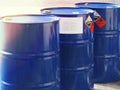 The close-up shot of blue color hazardous dangerous chemical barrels ,have warning labels of corrosive & flammable liquid Royalty Free Stock Photo