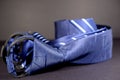 Close-up shot of a blue pre-tied adjustable zipper necktie with stripes