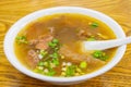 Close up shot of a bowl of beef noodle soup