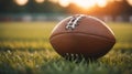 Close up shot of a brown leather football ball on grass football field American football .green background.AI generated Royalty Free Stock Photo