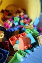 A close-up shot of a bucket of Scattered Legos on the Floor Royalty Free Stock Photo