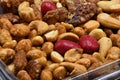 Mixed nuts in a plastic container Royalty Free Stock Photo