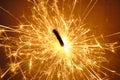 Close-up shot of a burning sparkling bright firework stick - holiday concept