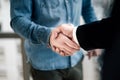 Close up shot of business handshake businessman entrepreneur freelancer shaking hands in celebration of new deal project start-up