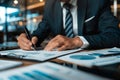 Close up shot of a businessman signing a business contract. Businessman writing on a paper document Royalty Free Stock Photo