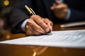 A close - up shot of a businessman signing a business contract. Generative AI Royalty Free Stock Photo