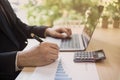 Close up shot of a businessman writing on charts paper at workstation. Modern business man writing on chart paper Royalty Free Stock Photo