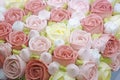 Close up shot of cake decorated with cream roses.