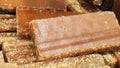 Close-up shot of cane candy. A pile of pieces of sugar are displayed for sale in the supermarket.