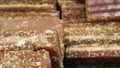 Close-up shot of cane candy. A pile of pieces of sugar are displayed for sale in the supermarket.