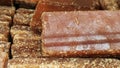 Close-up shot of cane candy. A pile of pieces of sugar are displayed for sale in the supermarket.