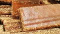 Close-up shot of cane candy. A pile of pieces of sugar are displayed for sale in the supermarket.