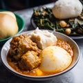 Close-Up Shot of Ghanaian Fufu with Soup and Vegetables