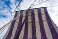 Detailed Close-Up of a Viking Longship Sailing under Clear Blue Skies