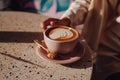 Close up shot of capuccino at table in cafe Royalty Free Stock Photo