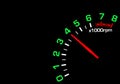 Close up shot of a car speedometer tachometer on black background. Royalty Free Stock Photo