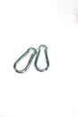 Close up shot of carabiner hooks isolated on a white background