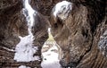 Close-up shot of cave stones partly covered in snow